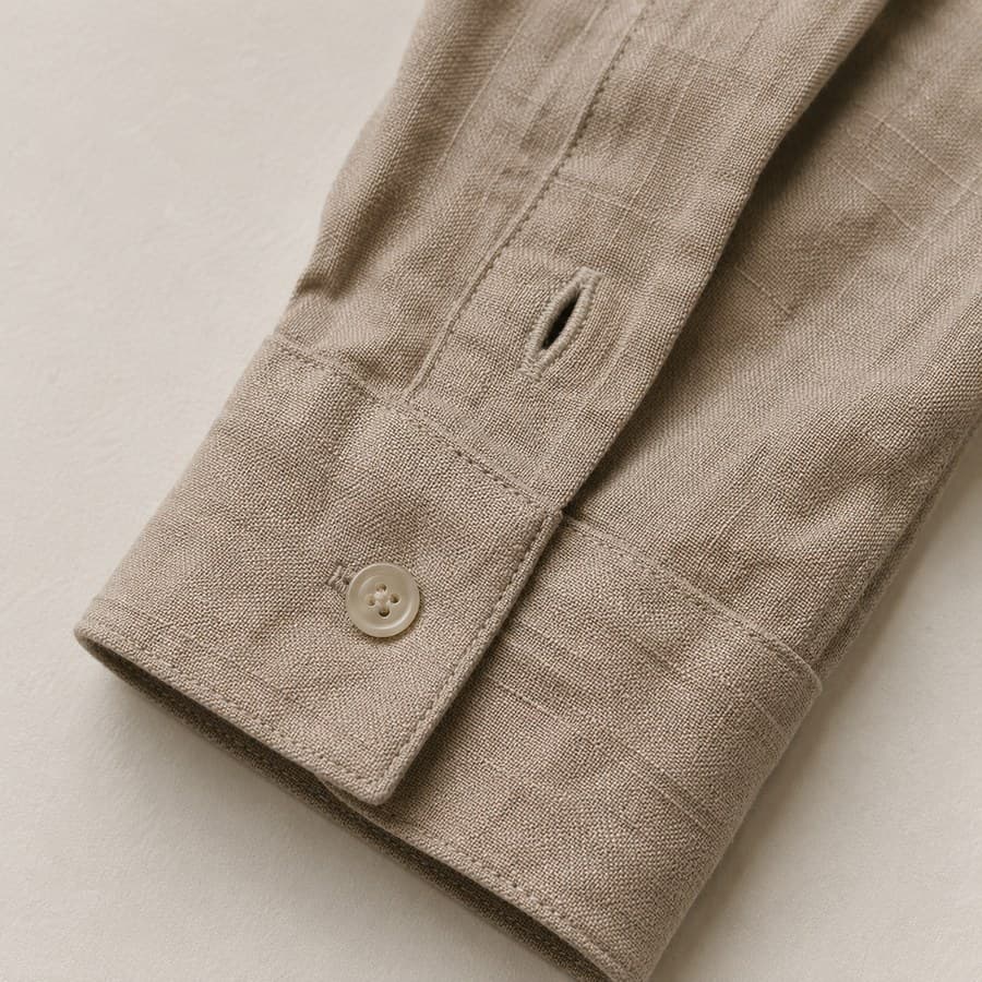 Shirt cuff and the last centimetres of a sleeve, laid flat